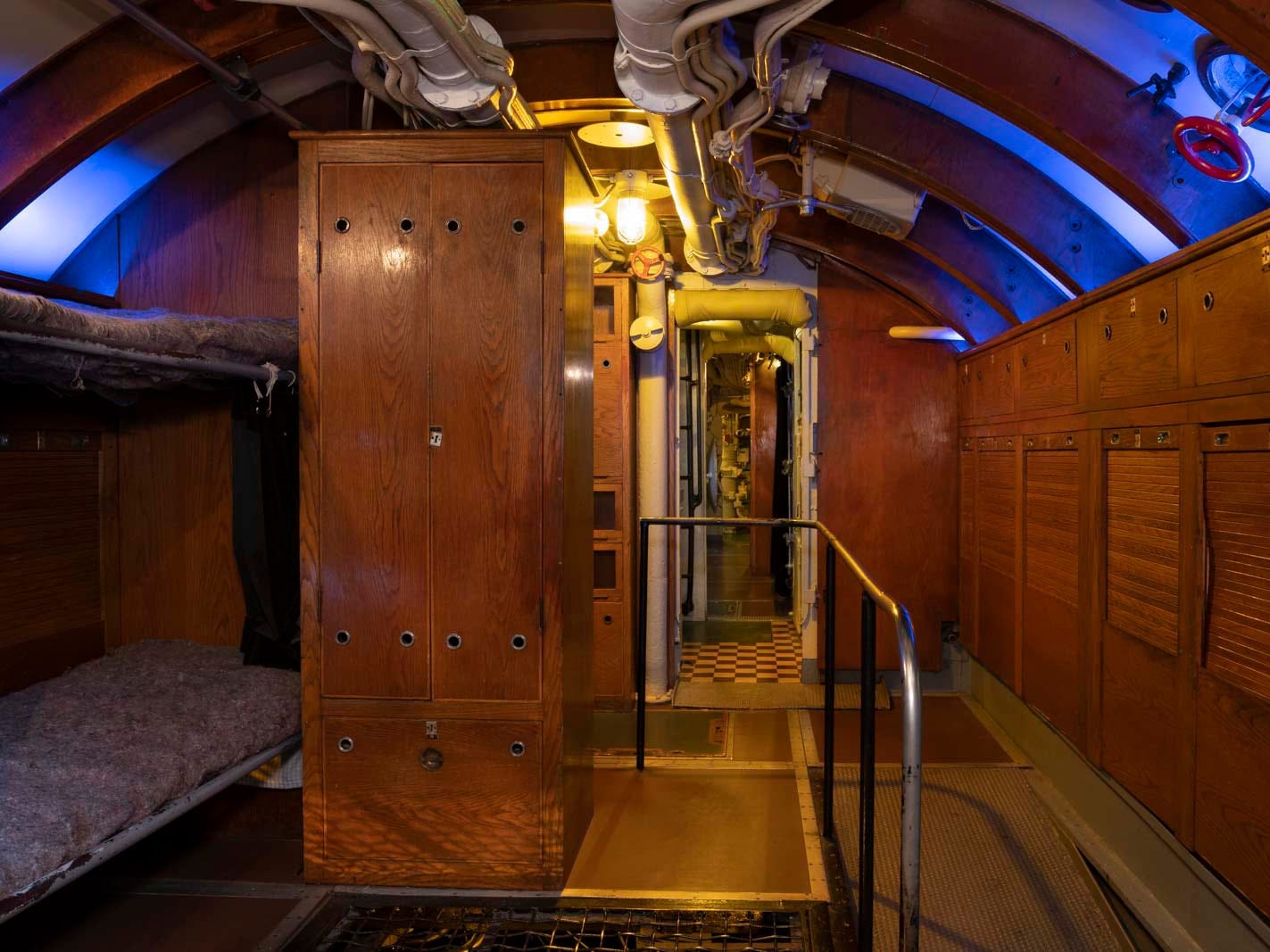 The officer's quarters were originally lined with bunks on either side. However, a set of beds on one side were removed to make it easier for visitors.