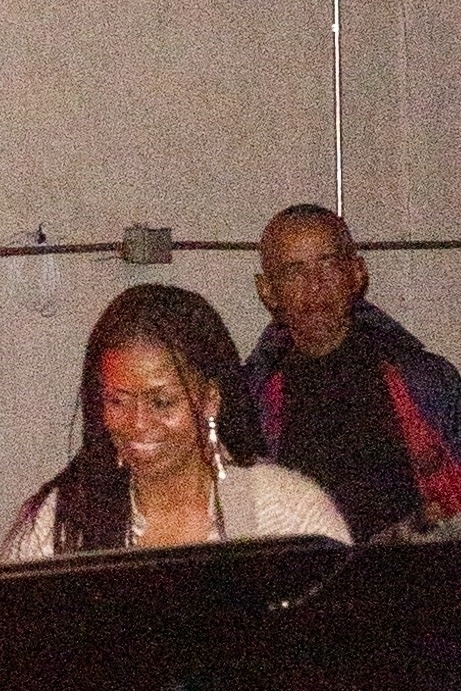 Barack and Michelle Obama leaving a restaurant.
