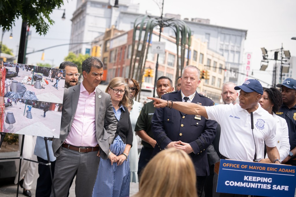 Mayor Eric Adams and administration officials at a press conference in the Bronx.