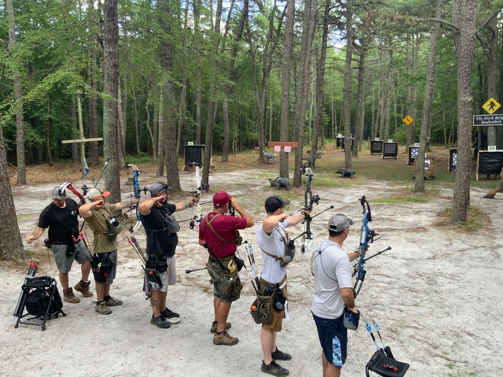 Archers at an archery range.