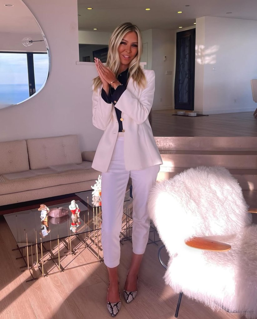 Sophia Hutchins in a white suit.