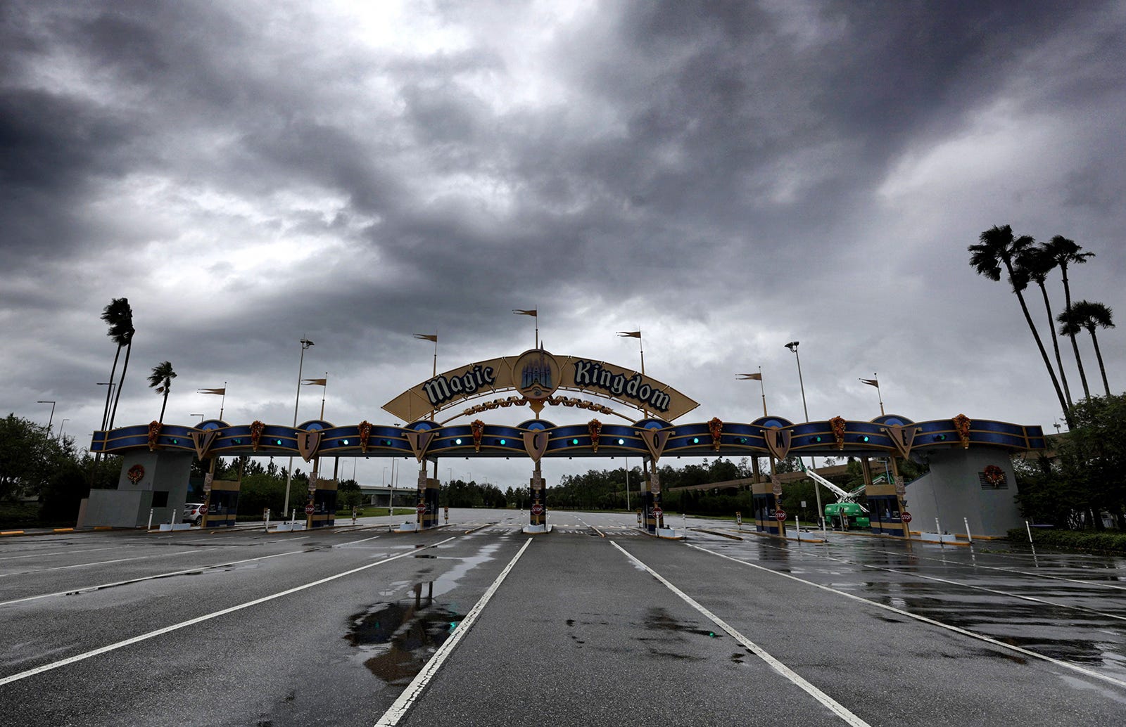 Magic Kingdom entrance with dark clouds looming over it