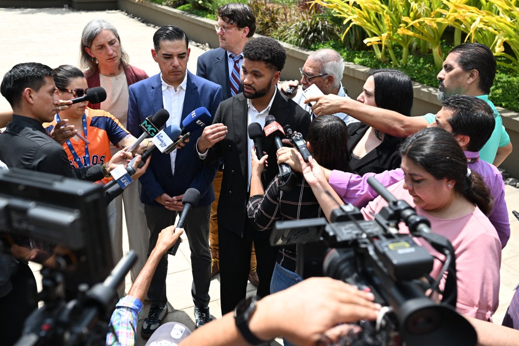 A US Congressman speaks to reporters at a press conference in El Salvador.