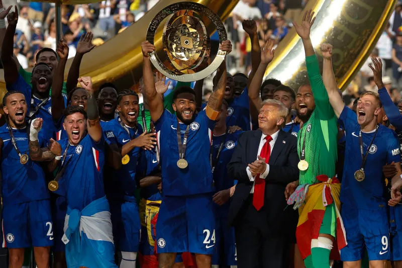 Chelsea FC celebrates with the FIFA Club World Cup trophy after the team’s victory as U.S. President Donald Trump looks on at MetLife Stadium in East Rutherford, New Jersey, on July 13.