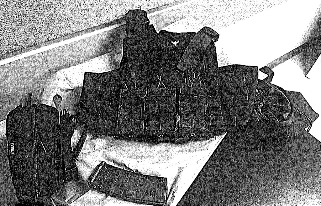 Court documents showing evidence: body armor, backpack, and magazine.