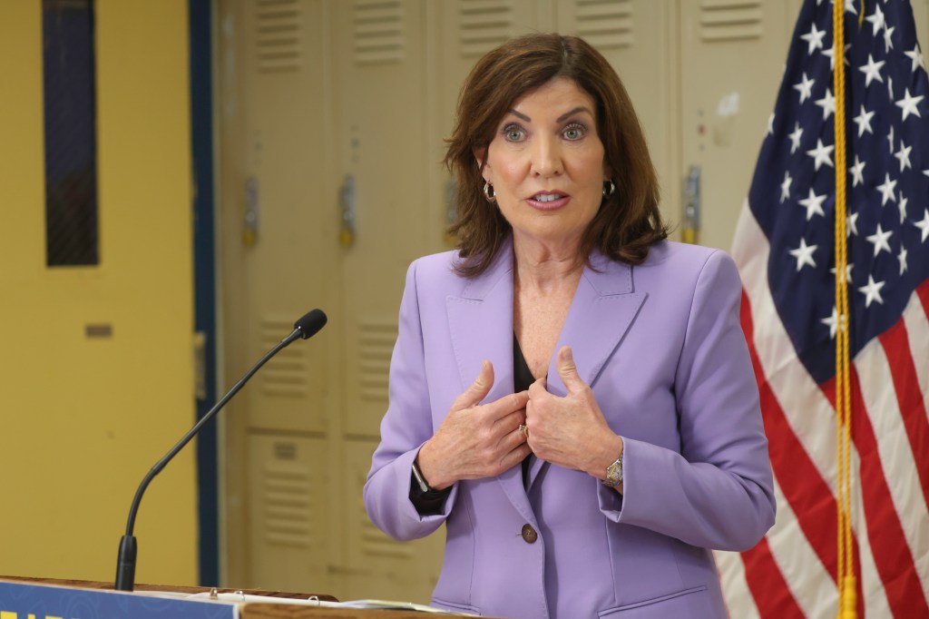 Governor Kathy Hochul speaking at a podium.