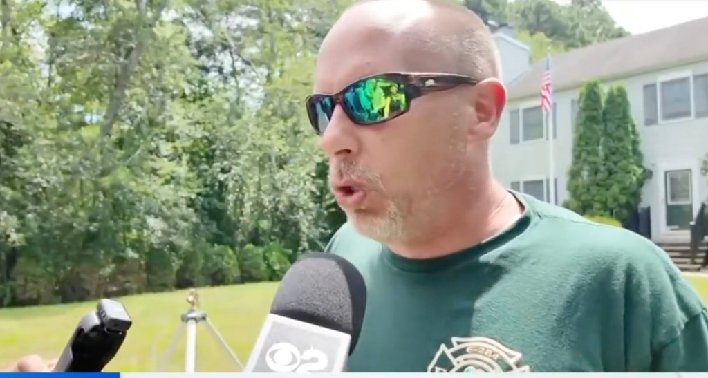 Man in sunglasses being interviewed about a lightning strike at an archery lesson.