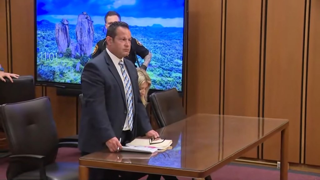 Judge and defense attorney at sentencing.
