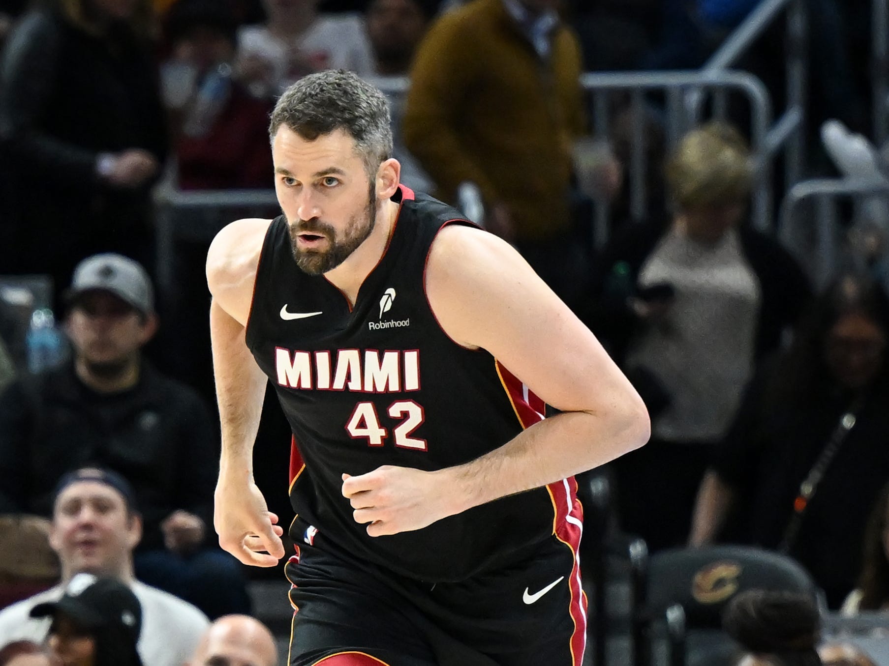 NBA star Kevin Love runs down the court during a game