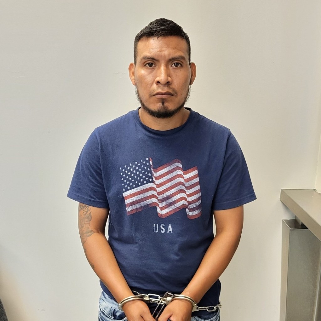 Photo of a man in handcuffs.