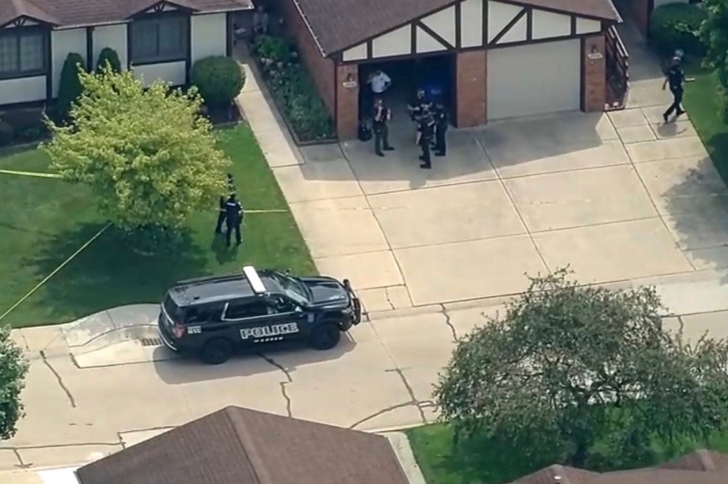 Aerial view of police at a crime scene.