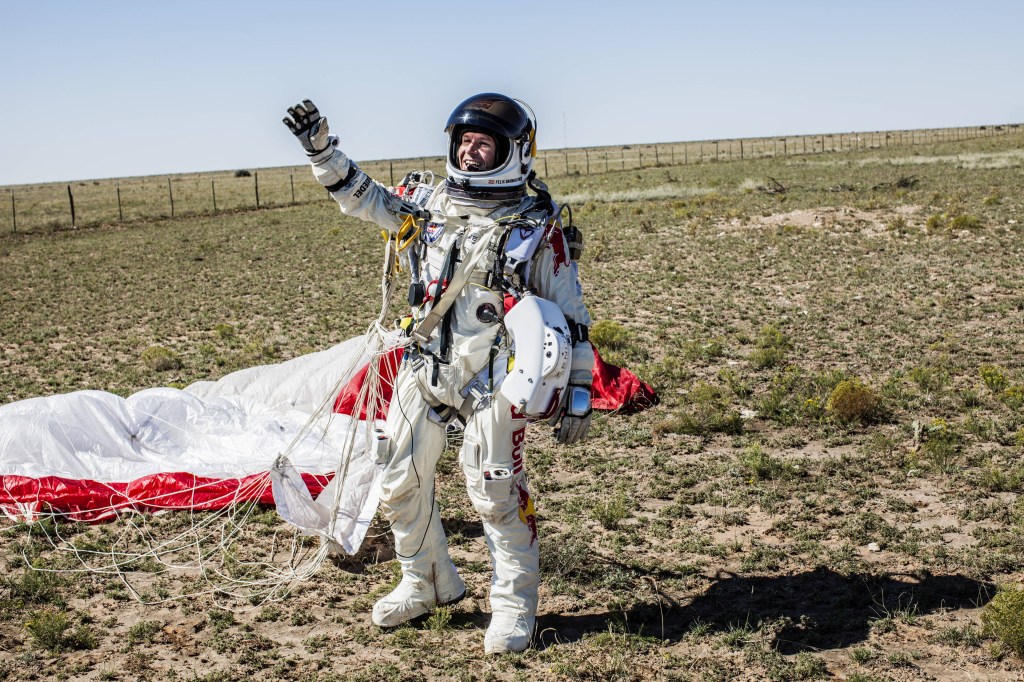 Felix Baumgartner celebrates after successfully completing the final manned flight for Red Bull Stratos in Roswell, New Mexico on October 14, 2012.