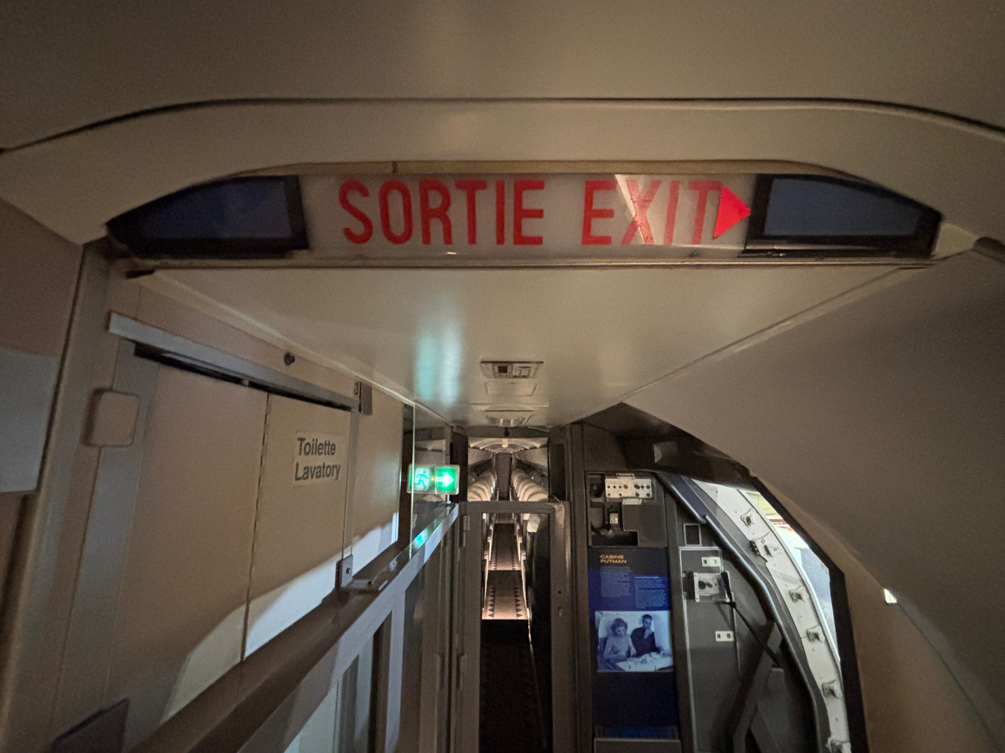 A view of the exit sign above the aisle on board Concorde Sierra Delta at Paris's Musée de l'Air et de l'Espace