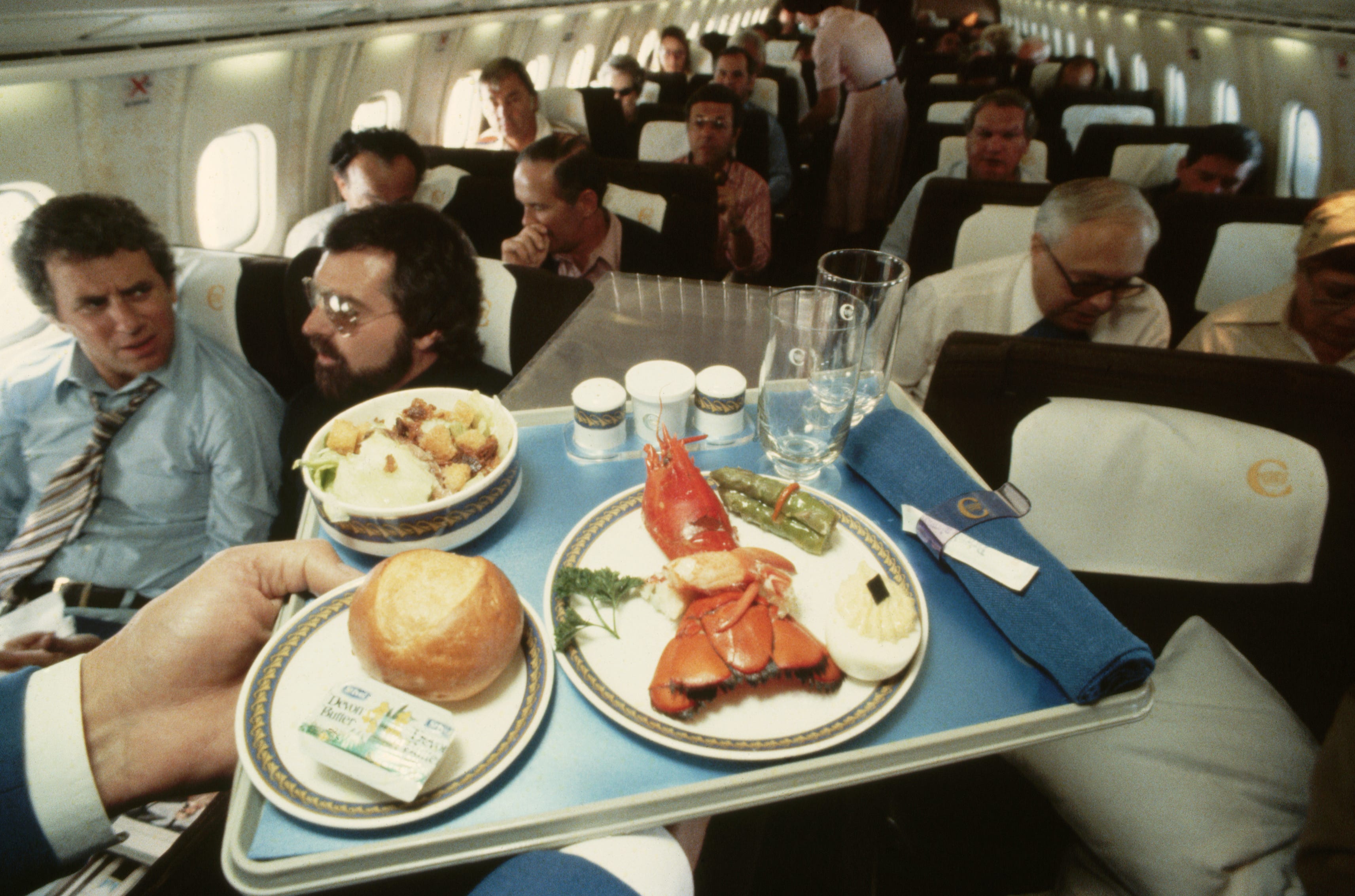 A lobster dinner on the Concorde, as the plane flies over the Atlantic Ocean.