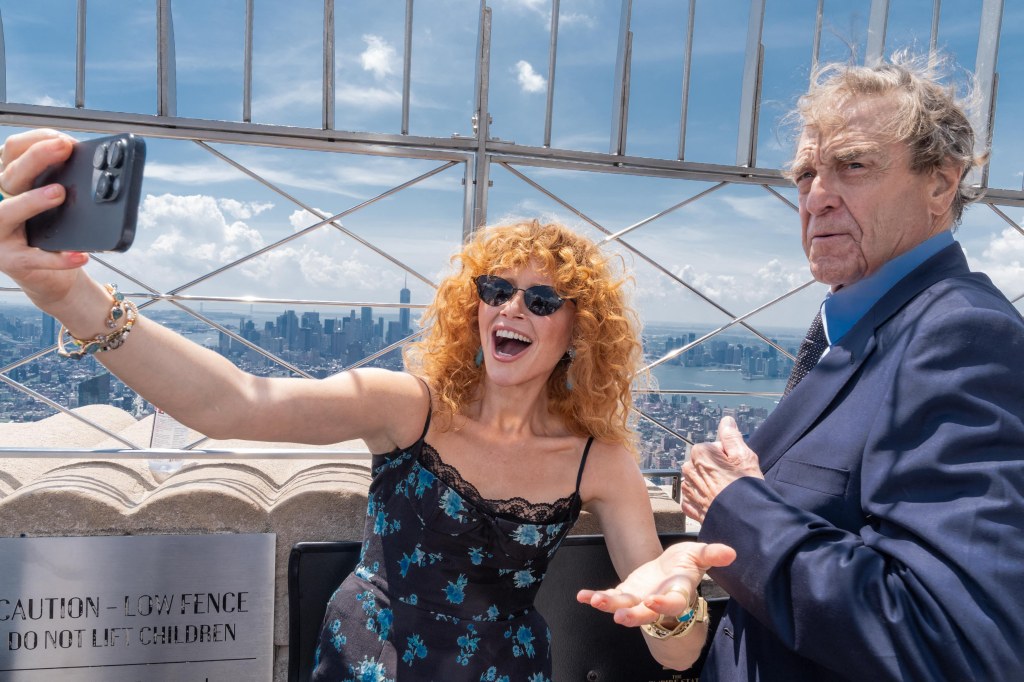 Natasha Lyonne and John Goodman, who voice characters in the new “Smurfs” movie, hit the top of the Empire State Building for a ceremonial lighting in honor of the film.
