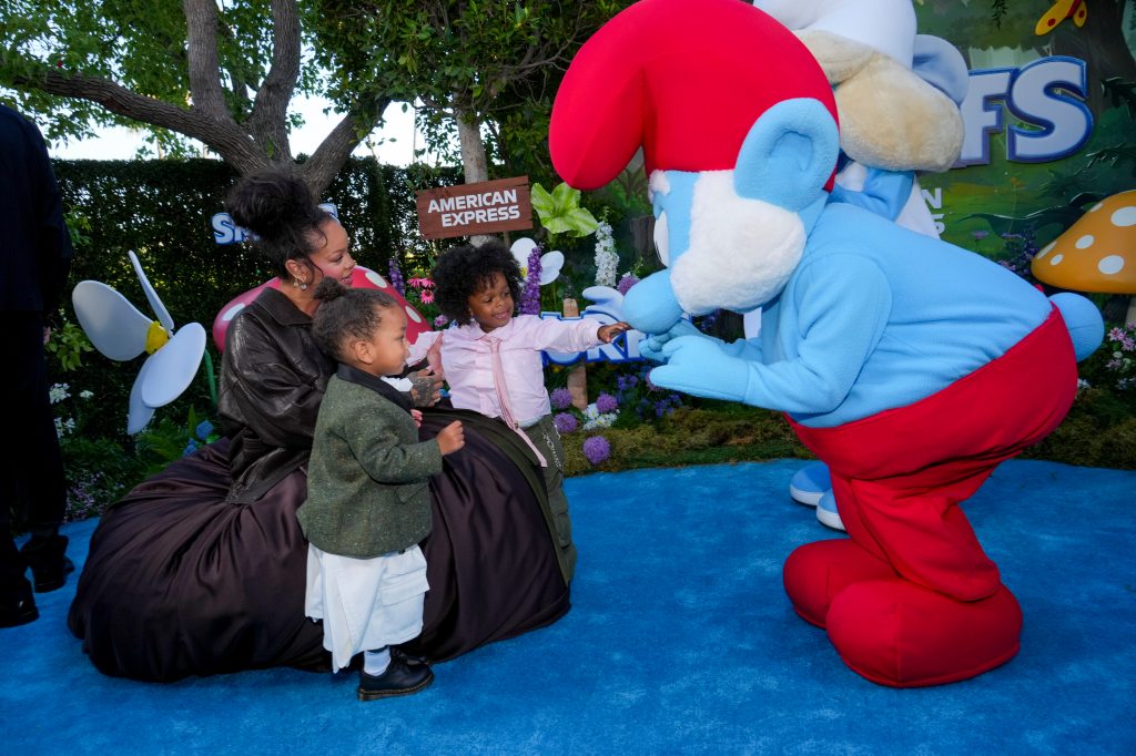At the LA premiere of “Smurfs,” Rihanna introduces sons Riot, 1, and RZA, 3, to her co-star.
