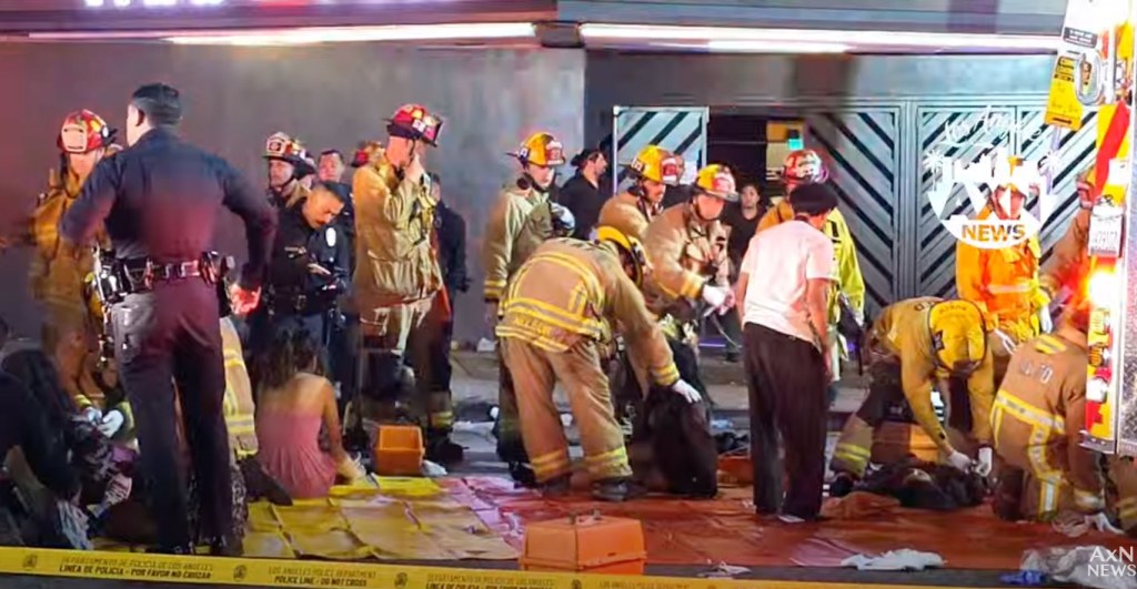 Emergency responders attending to injured people at the scene of an accident.