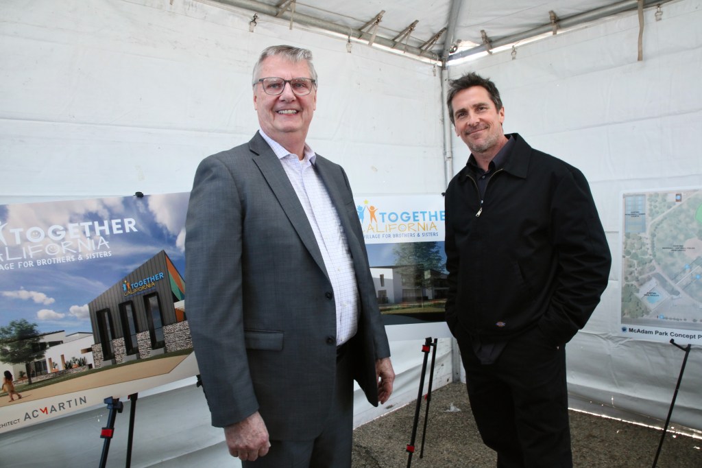 Christian Bale and Tim McCormick at a groundbreaking ceremony for a new foster care center.
