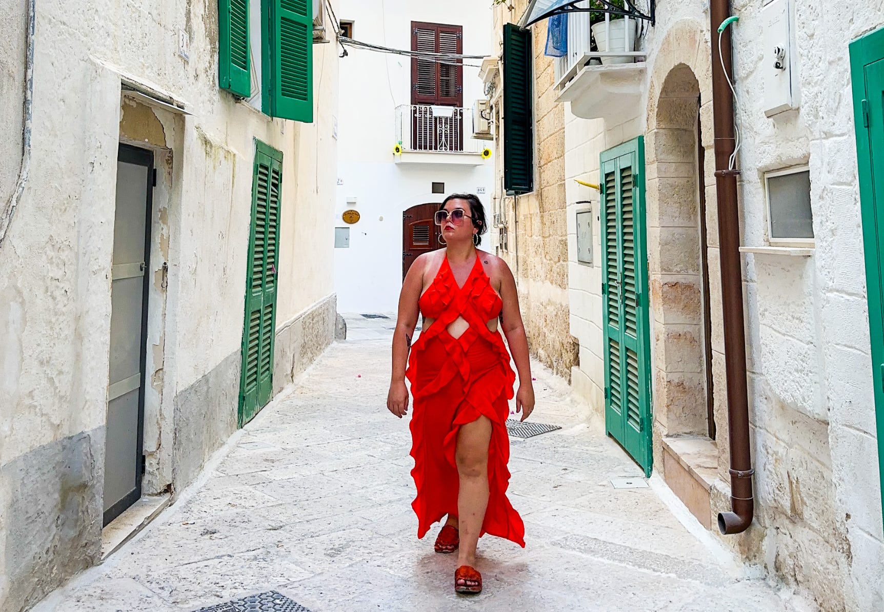 The writer walking down the street in Monopoli, Italy.