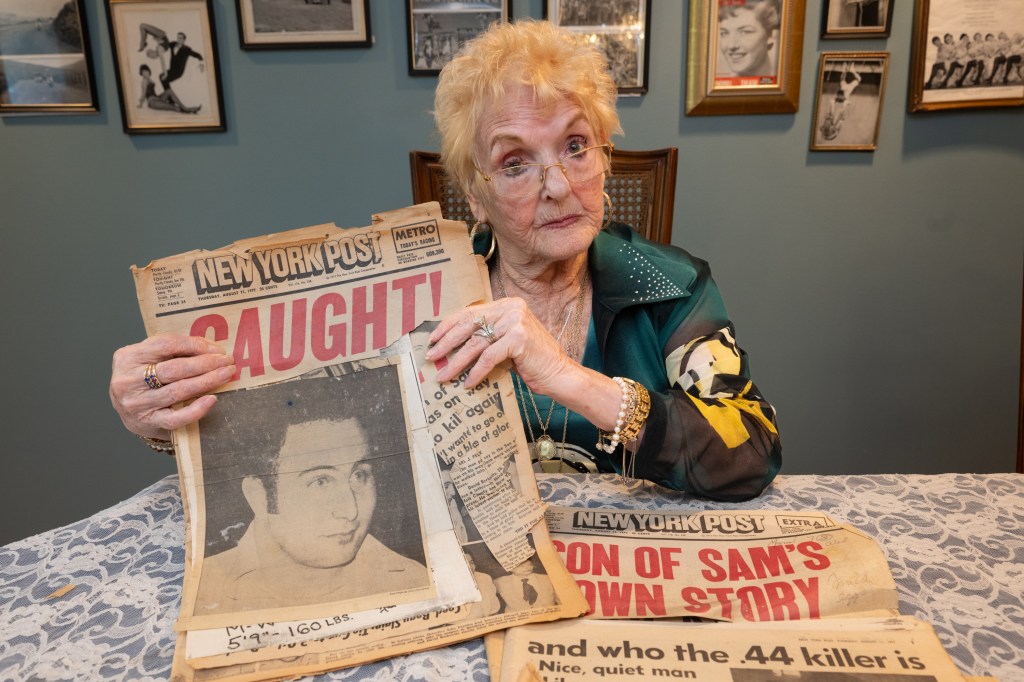 Woman holding vintage New York Post newspapers about the Son of Sam.