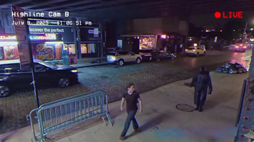 Screenshot from surveillance video showing mysterious cloaked man, carrying a sickle, scaring woman in Chelsea