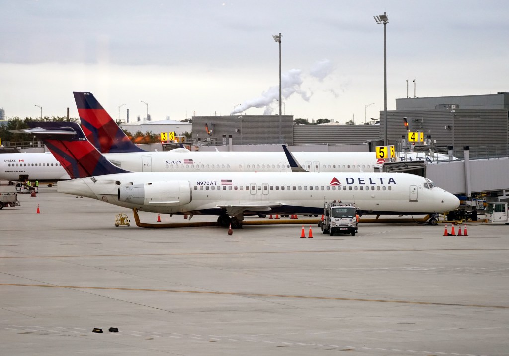 Delta Airlines plane at an airport gate.