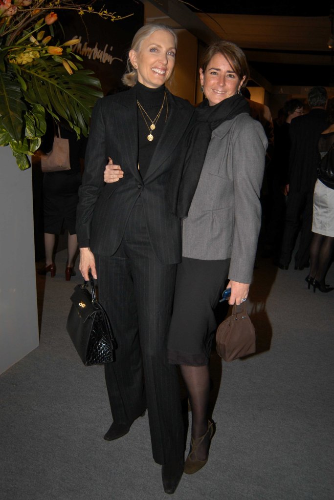 barbara guggenhiem and abigail asher smiling with their arms around each other