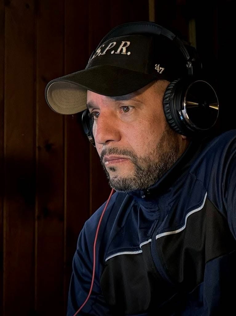 Paranormal investigator Dan Rivera wearing headphones.