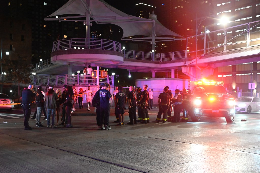 Man receiving medical treatment after being shot near a nightclub.
