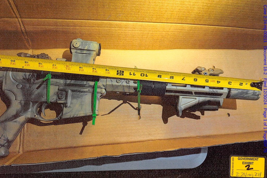 Seized rifle in cardboard box.