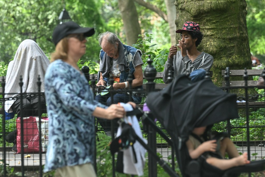 People sitting on a park bench.