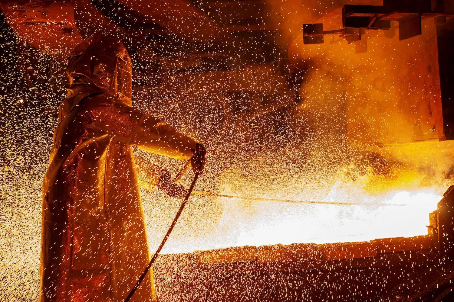 A worker mans a furnace during the nickel-smelting process in Indonesia’s South Sulawesi province.