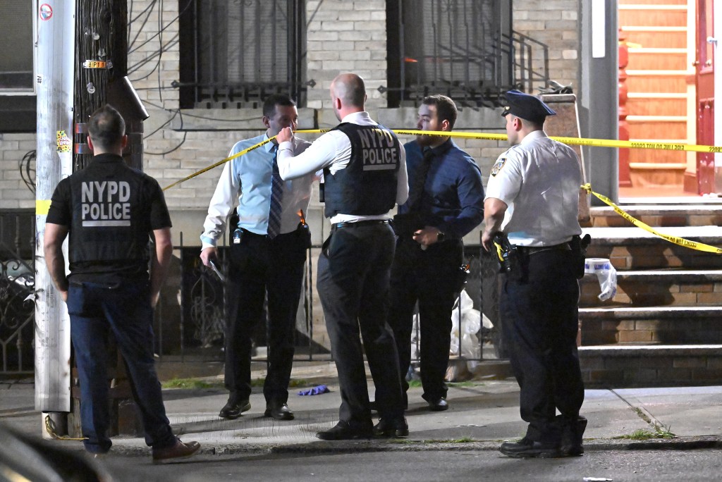NYPD officers at a Queens murder-suicide scene.