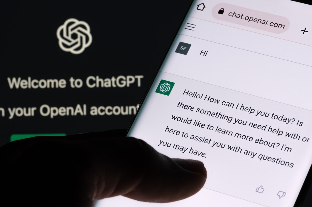 Smartphone displaying ChatGPT welcome message.