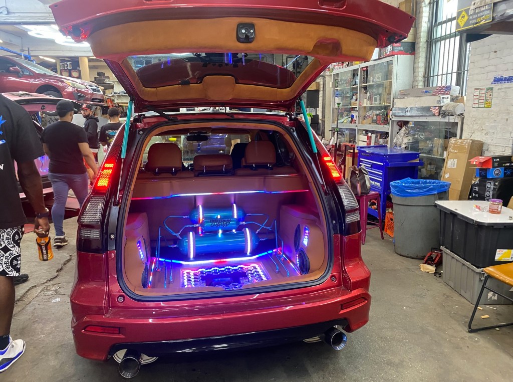 A car getting lights installed in the trunk at Inspire Auto Sound & Details.