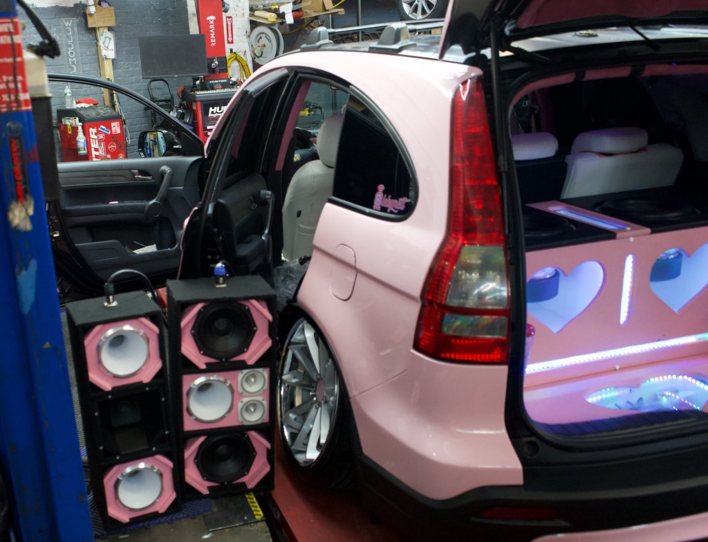 A car getting churchero speakers installed at Inspire Auto Sound & Details in The Bronx.