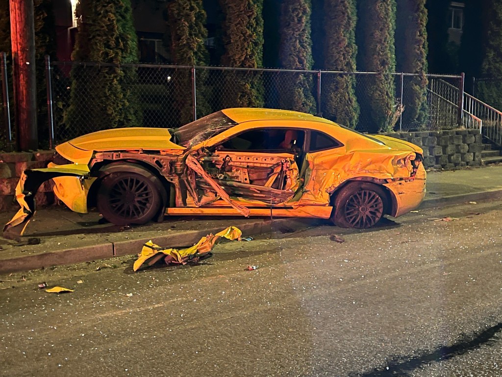 Severely damaged yellow car.