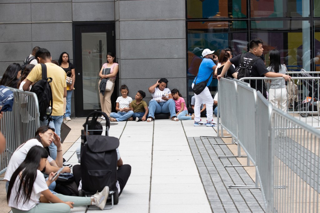 Migrants waiting to enter 26 Federal Plaza in Manhattan.