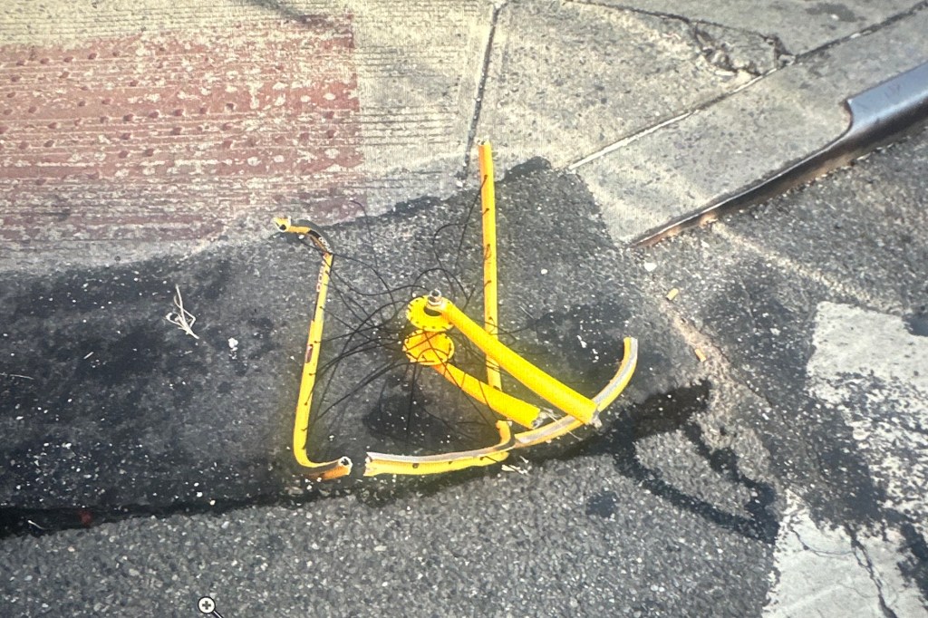 The mangled bike was seen in the aftermath. 