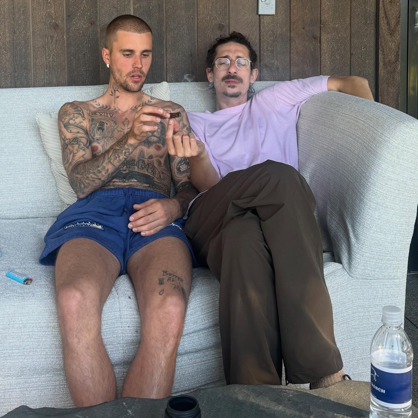 Justin Bieber passing a blunt with his friend
