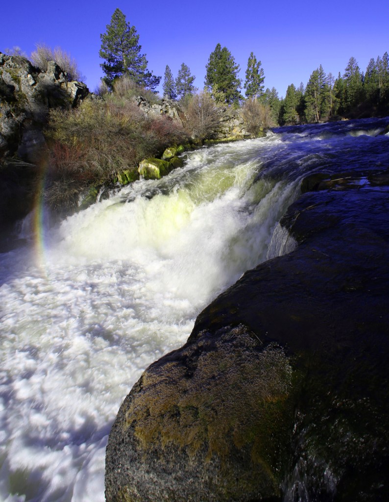 Rainbow over a waterfall.