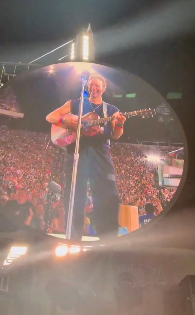 Chris Martin performing on stage. 