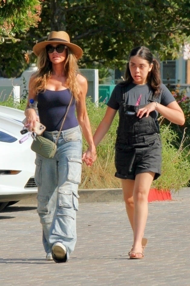 Denise Richards was spotted without her wedding ring after her estranged husband, Aaron Phypers, filed for divorce.