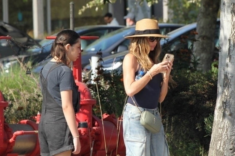 Denise Richards was spotted without her wedding ring after her estranged husband, Aaron Phypers, filed for divorce.