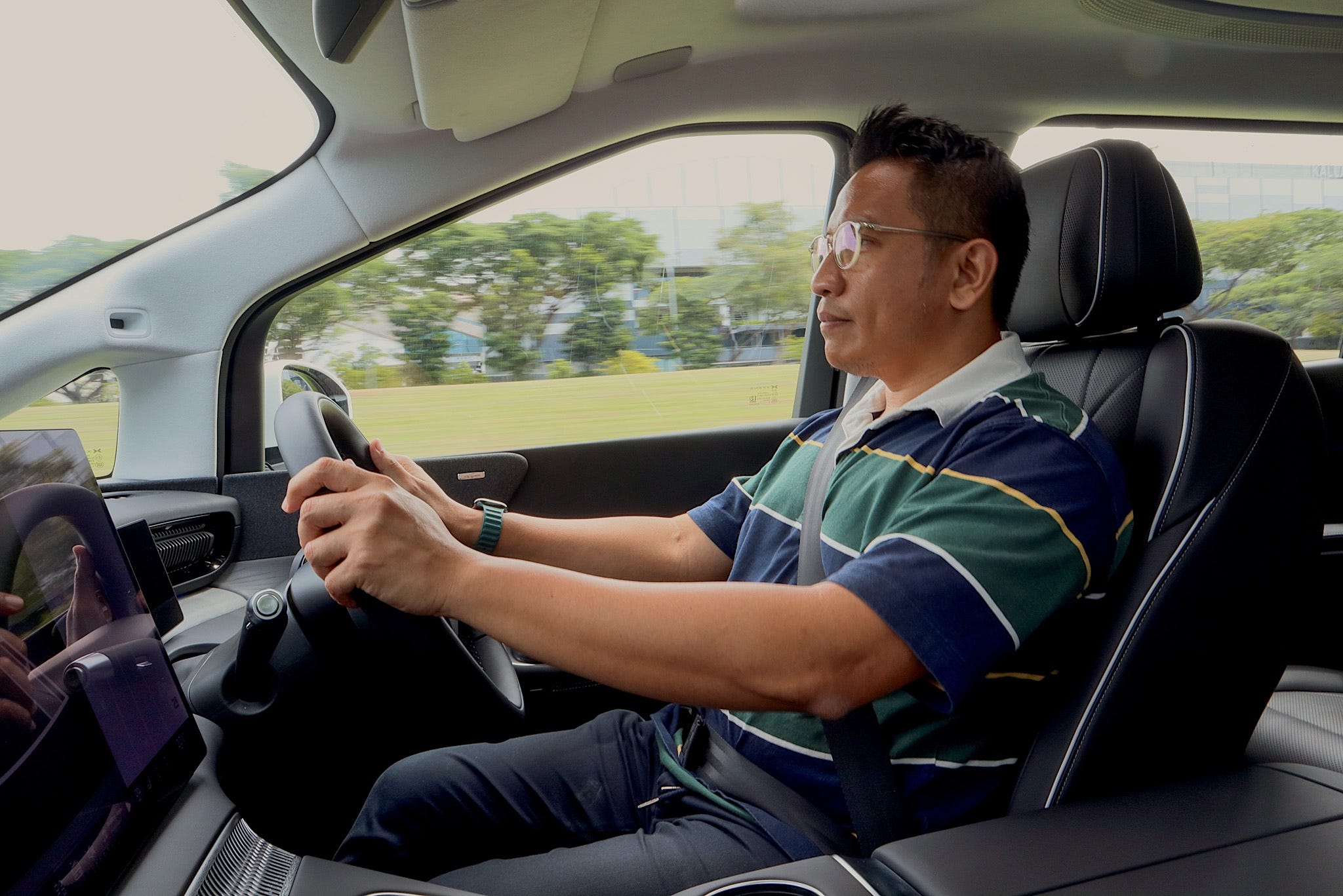 Azfar Hashim driving the XPeng X9.