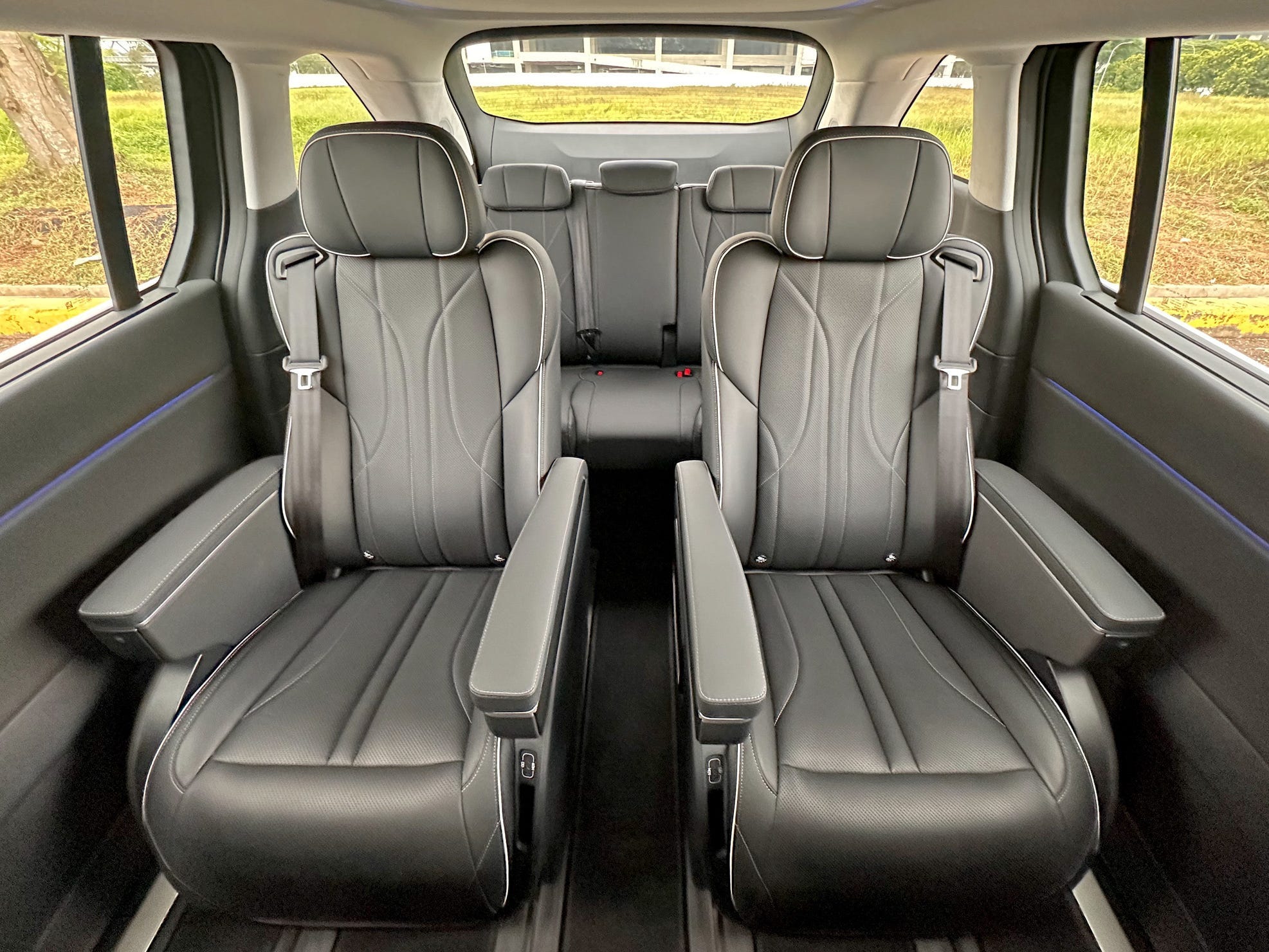 The back seats of the XPeng X9 have captain's chairs in the second row and a built-in fridge.