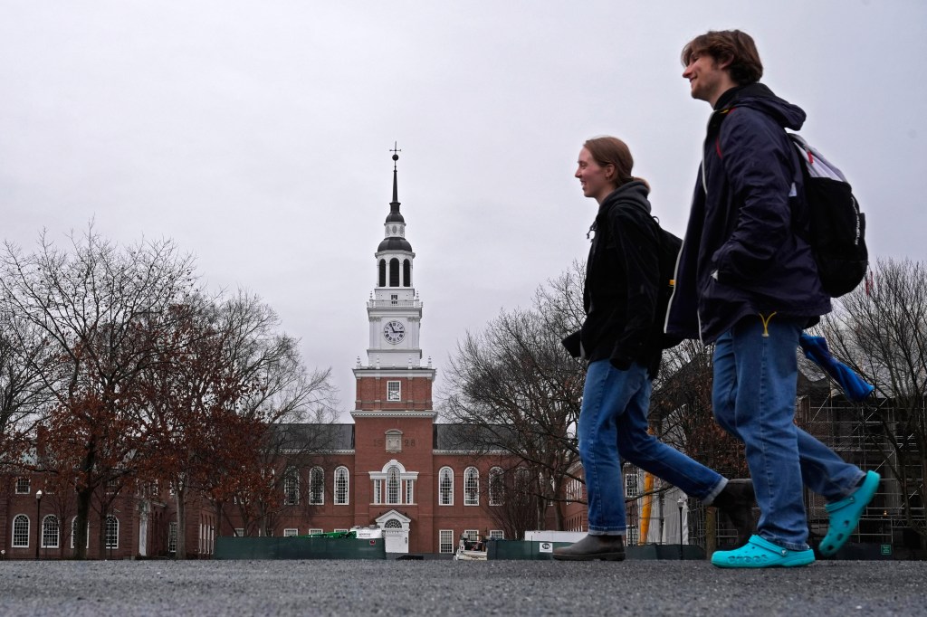 Two students walk past Dartmouth College.