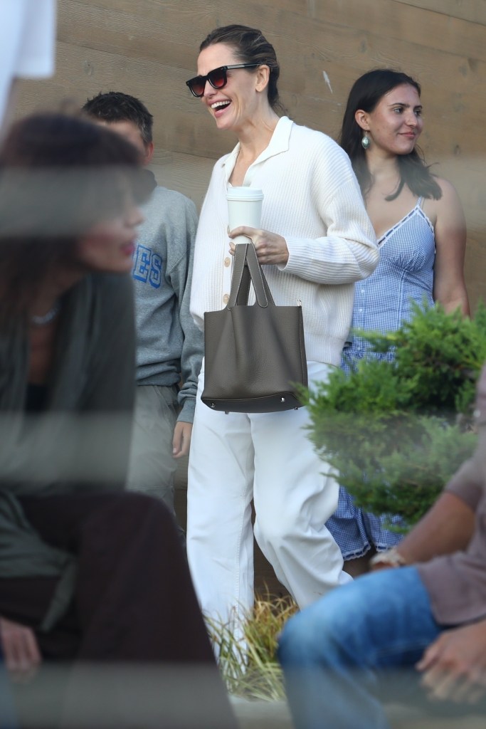 Jennifer Garner driving a car with Bradley Cooper inside at Nobu in Malibu, Calif.