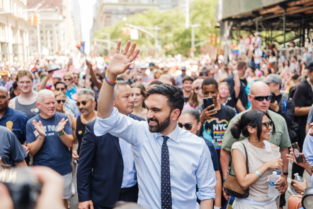 Zohran Mamdani waving at the NYC Pride Parade.