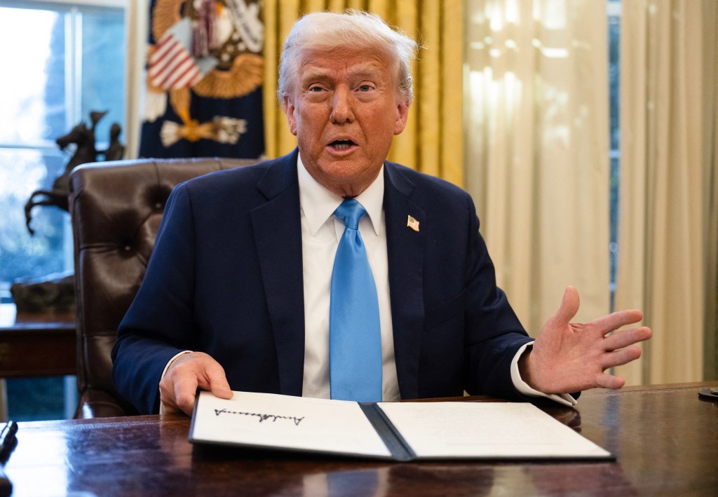 President Trump signing an executive order.
